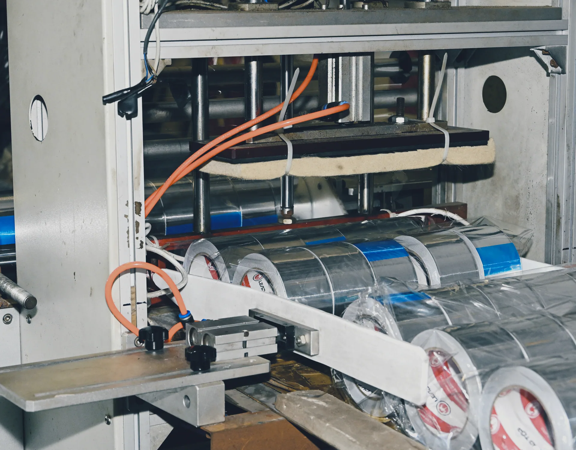Automatic packaging of finished tape rolls